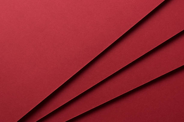Red Colored Paper Crossing High Angle View.